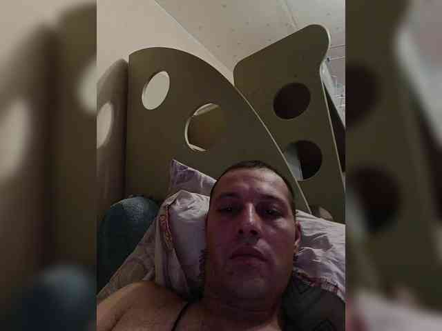 Artem (33, White Cam Boy) performing blowjob.